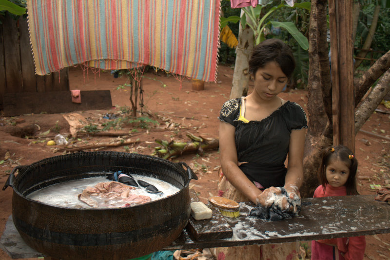 Paraguayan woman washing laundry